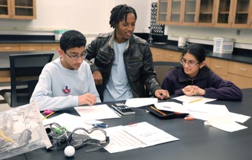 High school students conduct experiments.