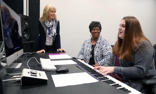 Babbie Mason, center, listens to student Simmerly Hardage's song as Dr. Toni Anderson, Coordinator of the Music Program, listens.