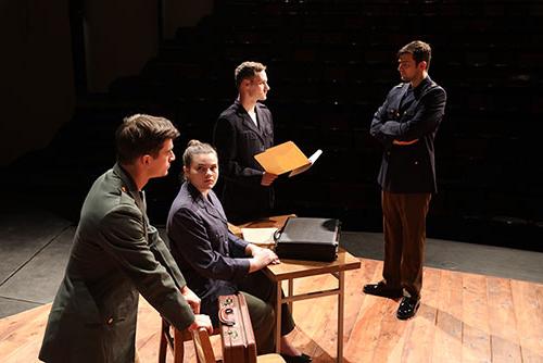 The cast of A Few Good Men rehearse for an upcoming performance