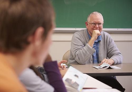 Dr. John Cook teaching a seminar.